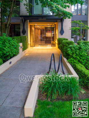Residential building entrance with bike rack in front