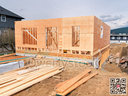 Wooden frame of a new house with engineered lumber materials in front