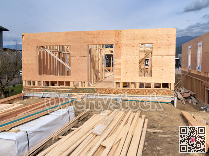 Wooden frame of a new house with engineered lumber materials in front