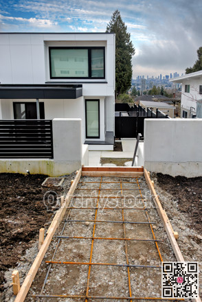 Pathway construction to the main entrance of brand new family house in suburban