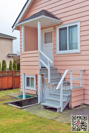 Small porch and stairs with entrance to the main and basement level