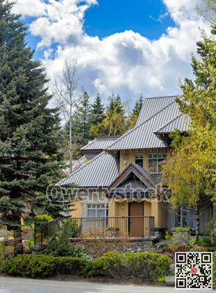 Luxurious residential house with big roof on spring season in Canada
