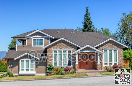 Luxury residential house with landscaped front yard and pawed pathway over it