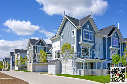 A perfect neighborhood. Brand new townhouses district on blue sky background