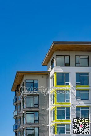 Corners of brand new residential building on blue sky background
