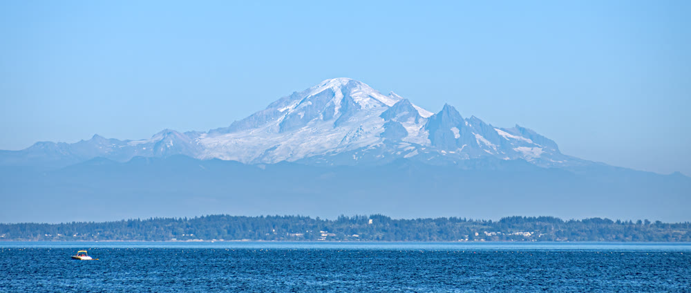 Beautiful view of mountain Baker from the Tsawwassen bech in the evening time