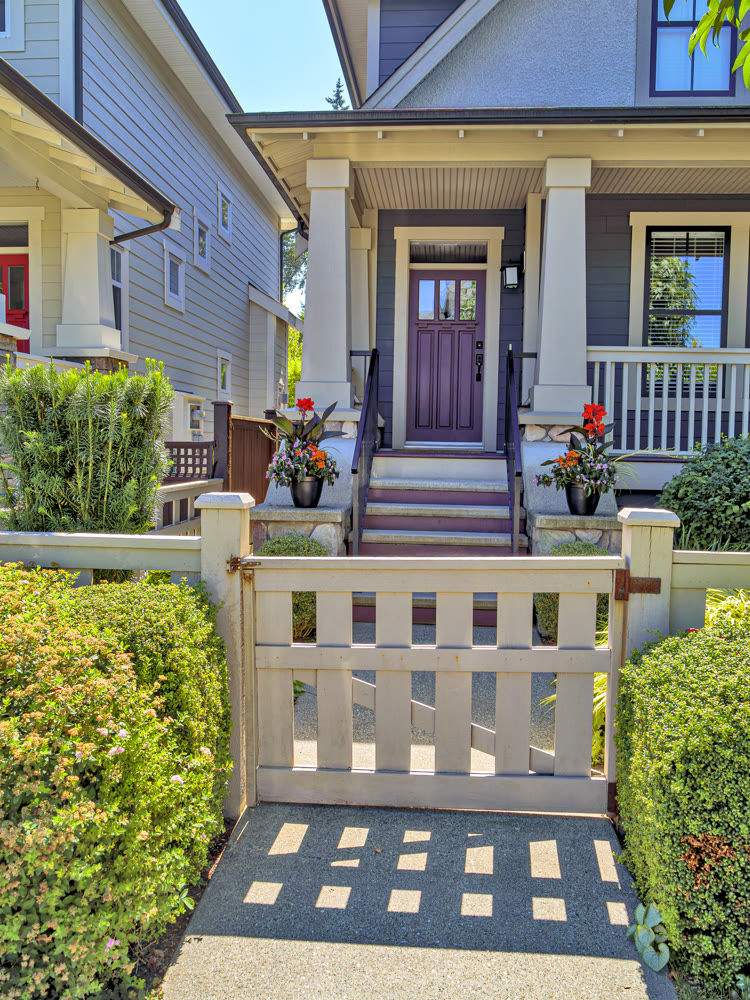 Porch and entrance of a nice residential house with two flower pots