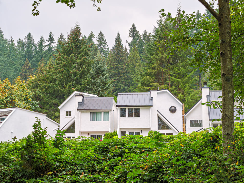 Raw of white residential houses on overcast autumn day in Canada