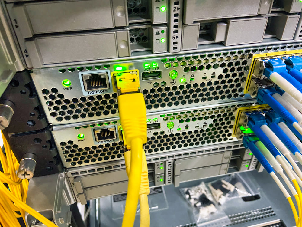Network equipment with green lights working in a data center