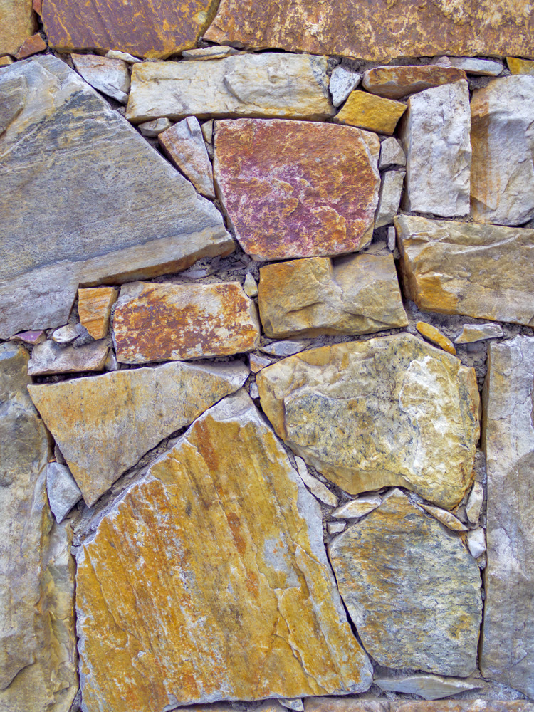 Roughly cut stones wall texture. Natural material background
