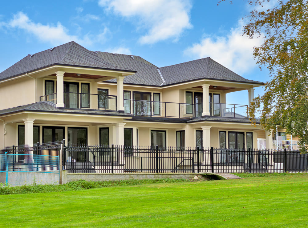A perfect neighbourhood. New luxury residential house on cloudy sky background