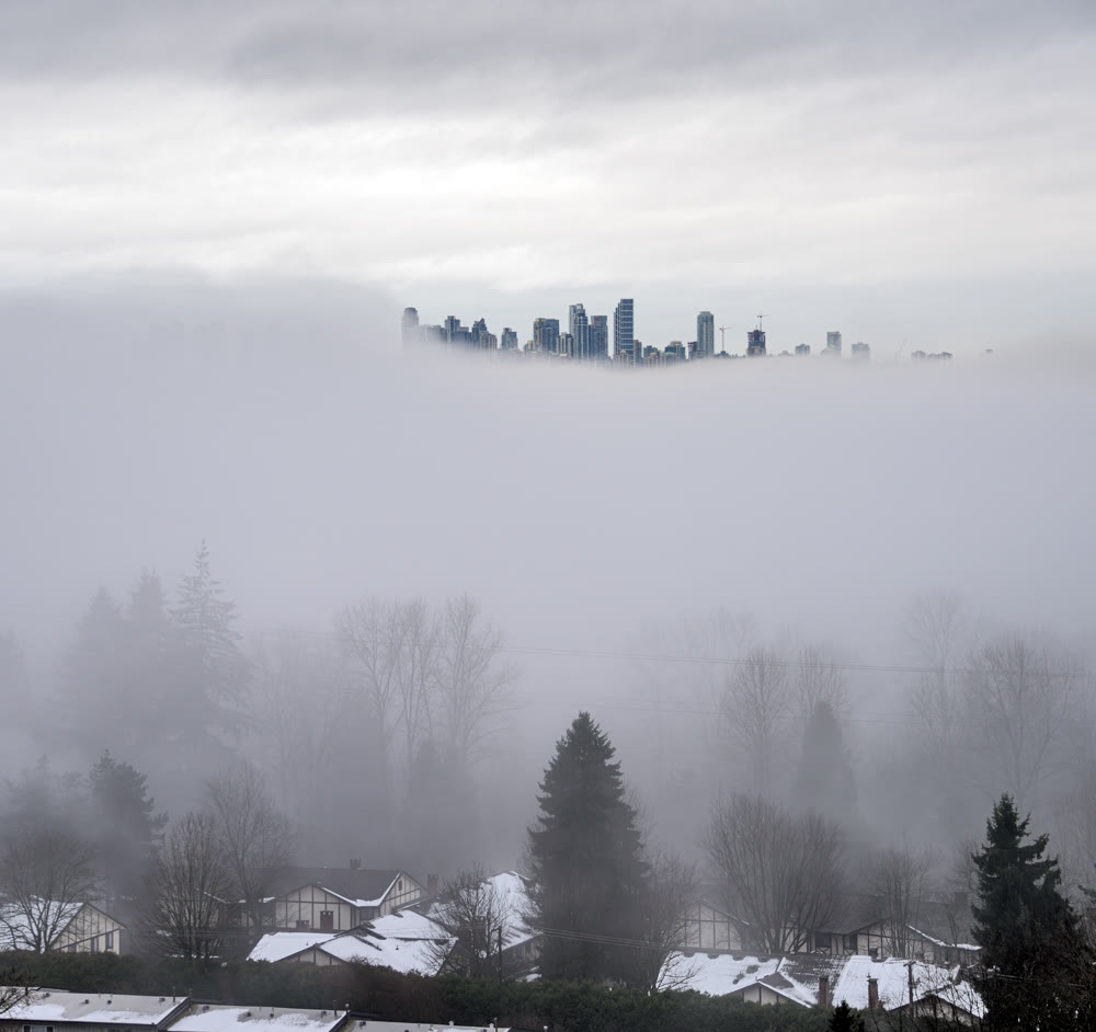 City in the sky. Foggy winter morning in Vancouver, Canada