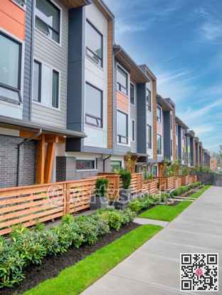 Walkway along a row of brand new townhouses on sale stage