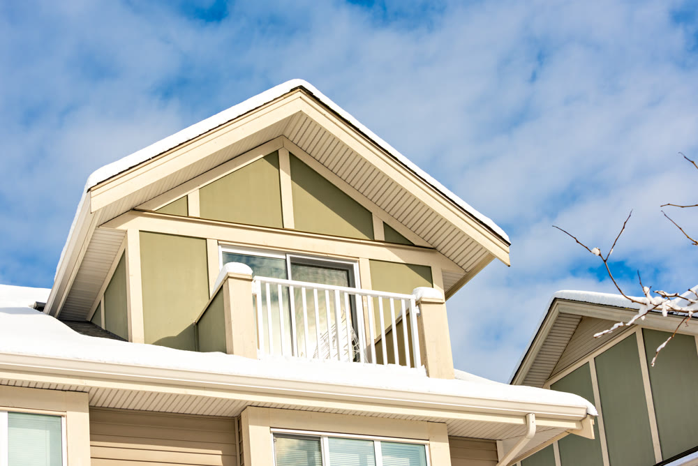 Top of residential house on blue sky background on winter season in Canada