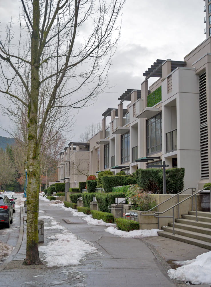 Row of residential townhouses on overcast winter day in Coquitlam, BC