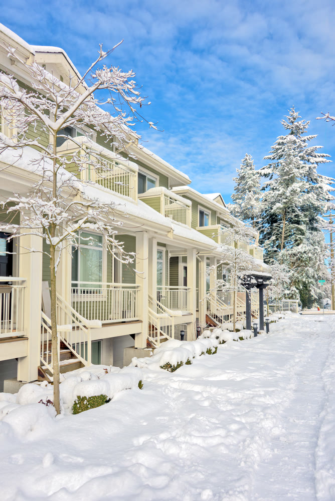 Row of residential townhouses on bright winter day in Vancouver, BC