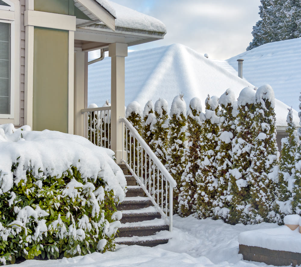 Porch and doorsteps of residential house in snow