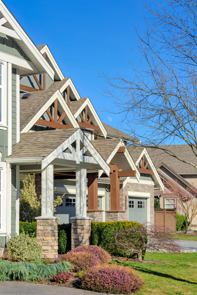 Front side of residential house on blue sky background