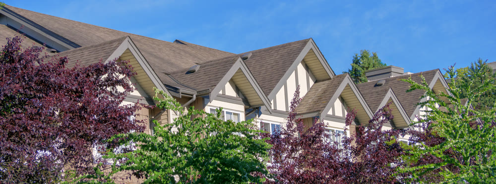 Rooftop level of residential building on blue sky background
