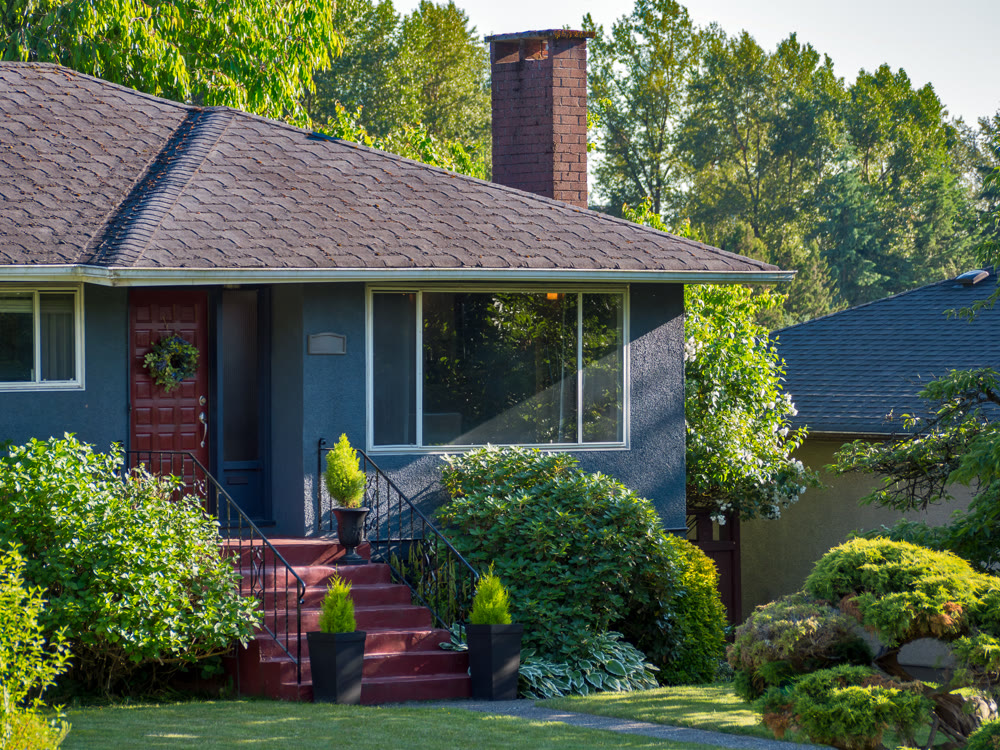 Main entrance of detached residential house on warm summer everning