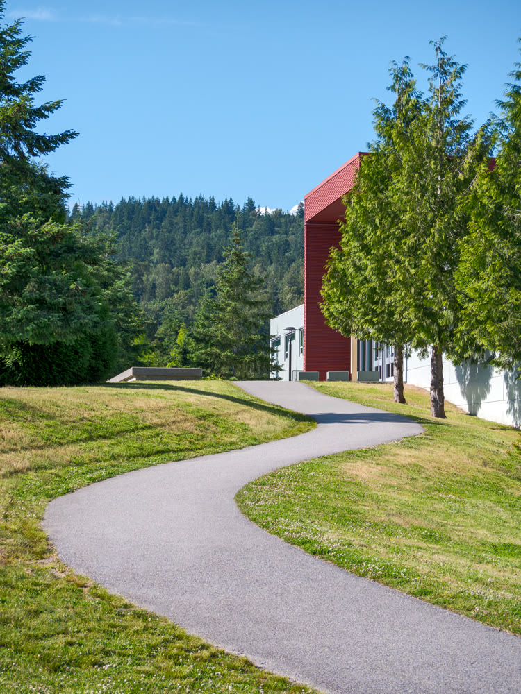 A winding path on the slope leading to an office building