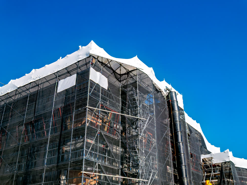 Office building under construction on blue sky background