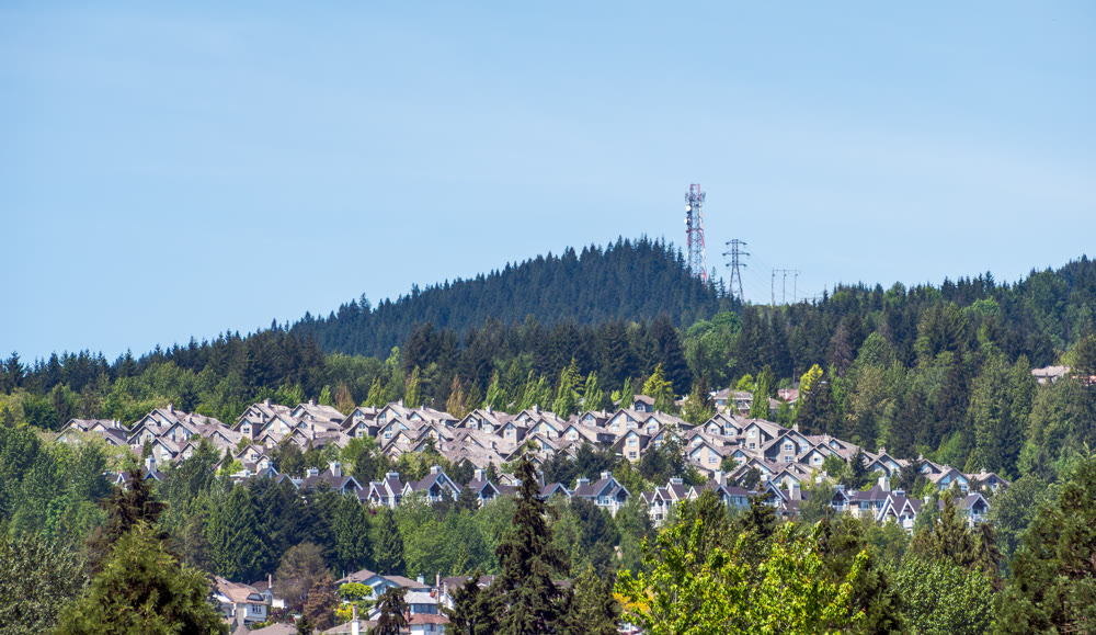 Townscape of residential district on mountain and blue sky background