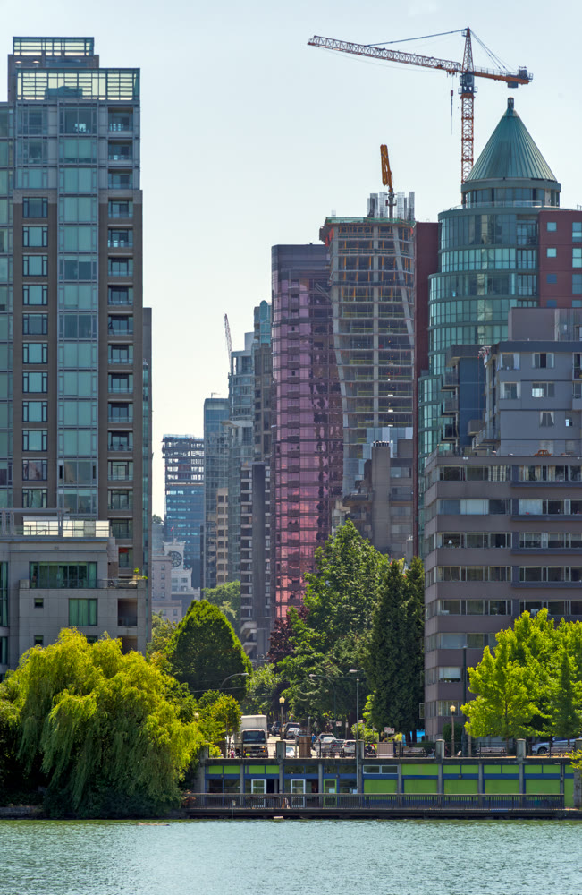 View at one of Vancouver downtown streets with high-rise residential buildings at the waterfront