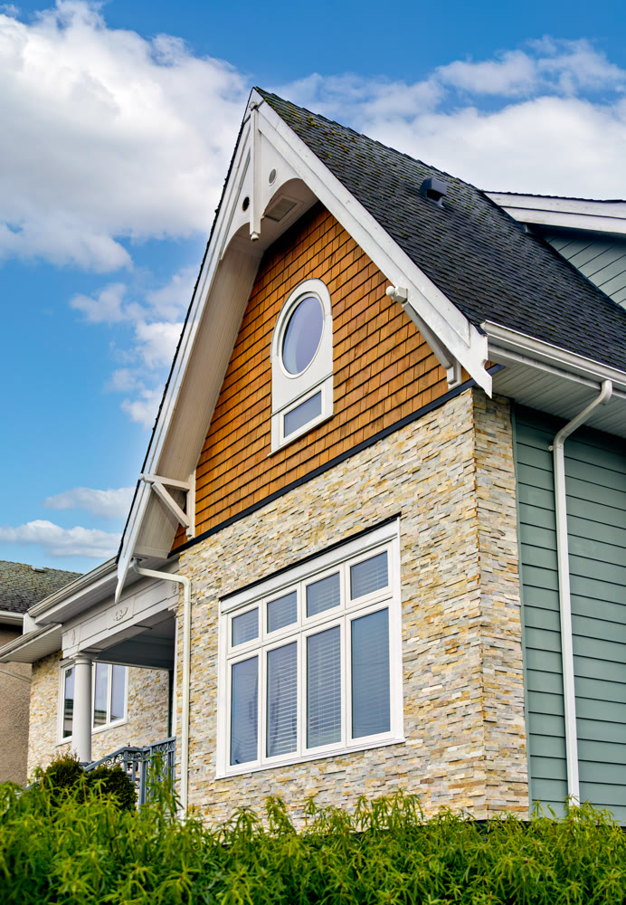 Front side of residential house on cloudy sky background in Canada