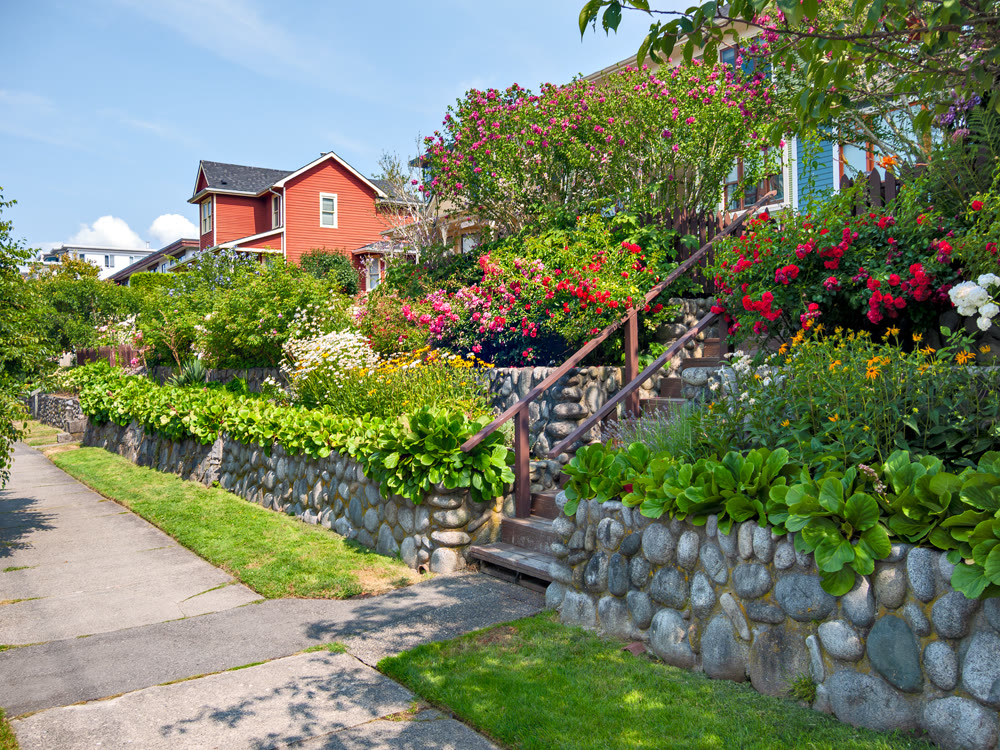 A perfect neighborhood. Area of residential houses with land terraces decorated with flowers