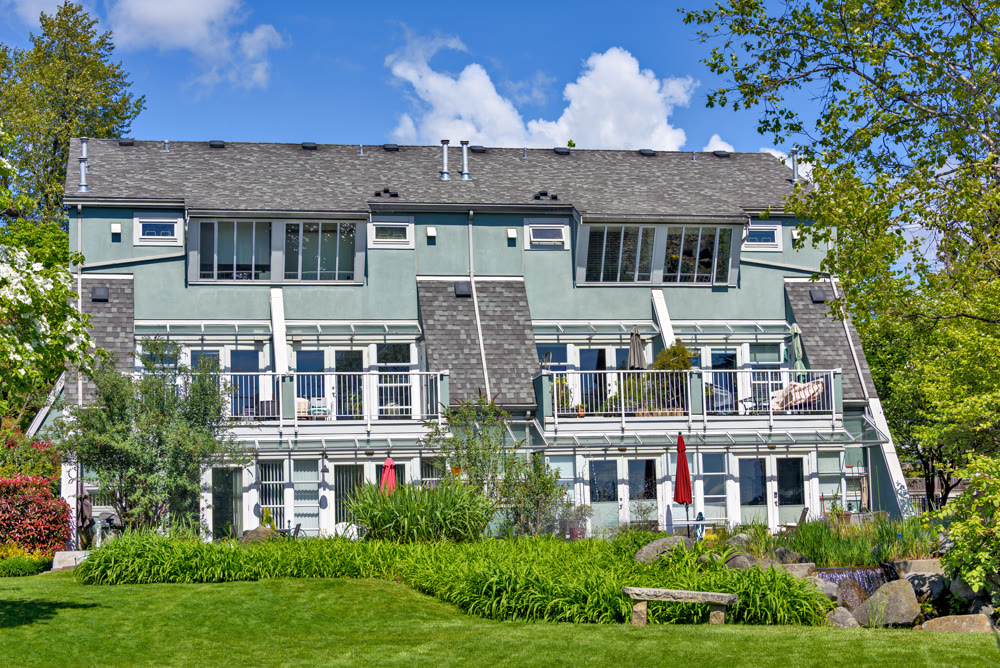 Quadruplex residential building of townhouses on sunny summer day