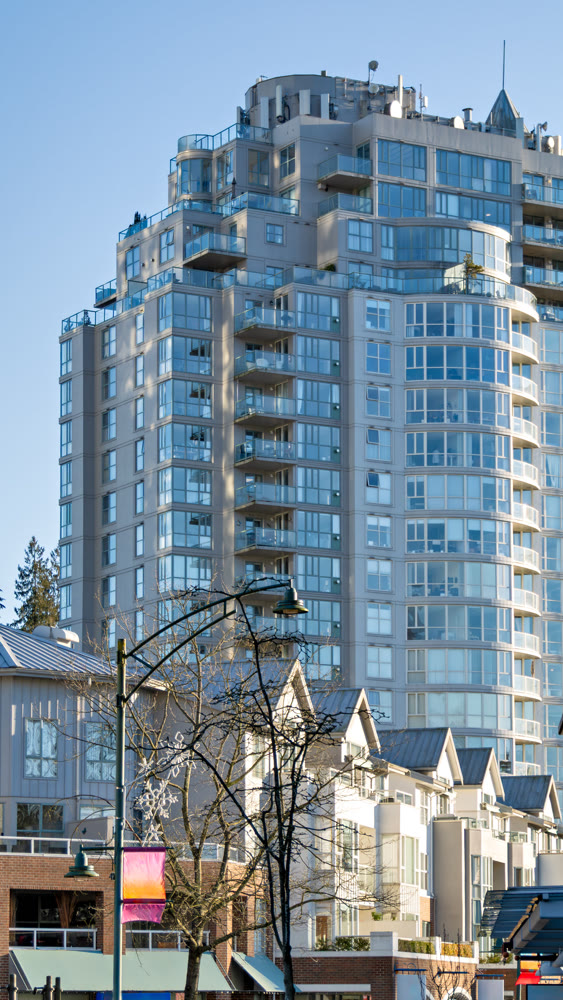 Residential high-rise and low-rise buildings on blue sky background