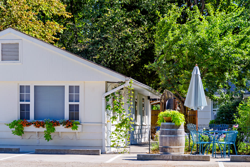 White resort house on bright sunny day in Okanagan valley