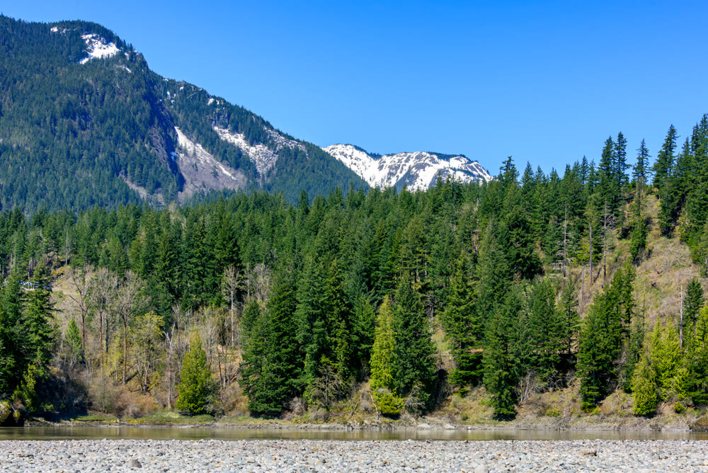 View at snowy mountains in British Columbia. Stoney mountain riverbed