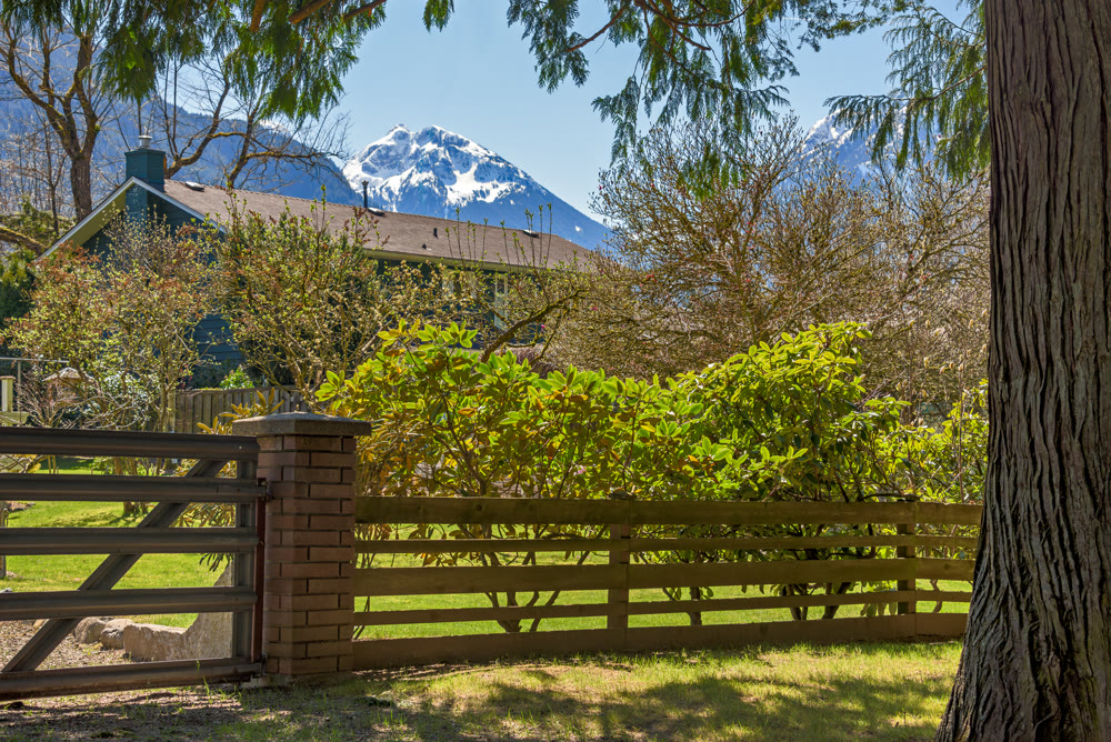 Gated residential area of a small town in Canada with snow top mountain view