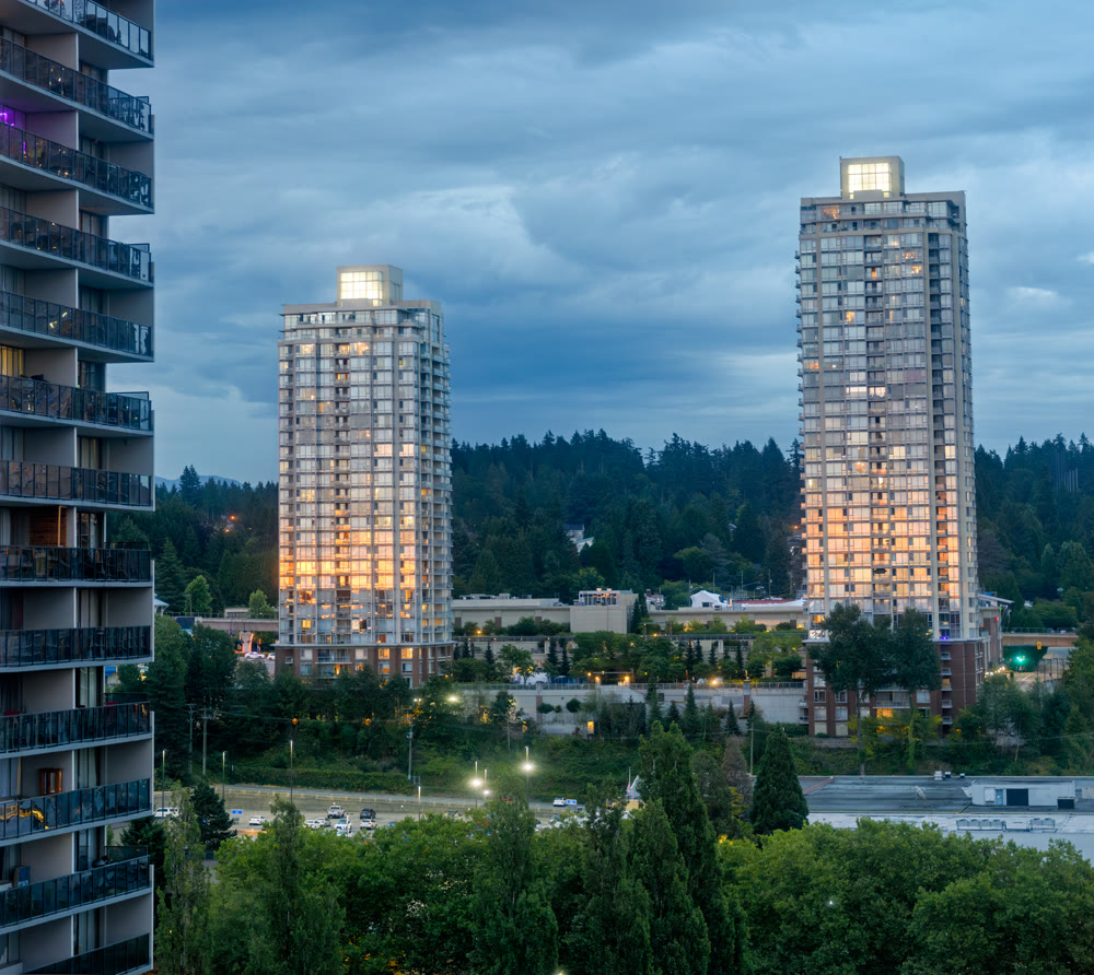 Sunset reflection in windows of high-rise buildings at Lougheed City Center