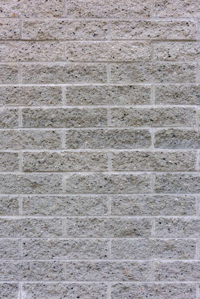 Concrete wall stylized under texture of silicate brick masonry