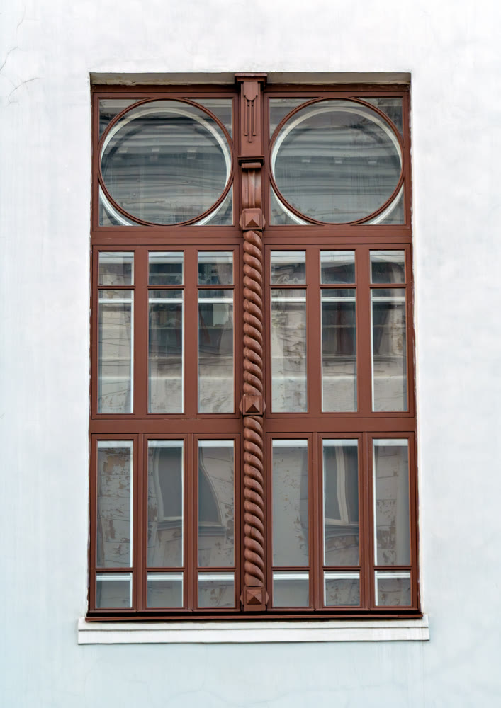 Restored original window of historic building in downtown of Krasnoyarsk city