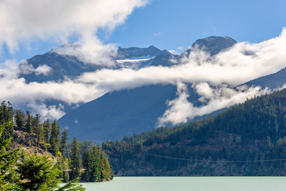 Mountain landscape with cloudy blue sky background
