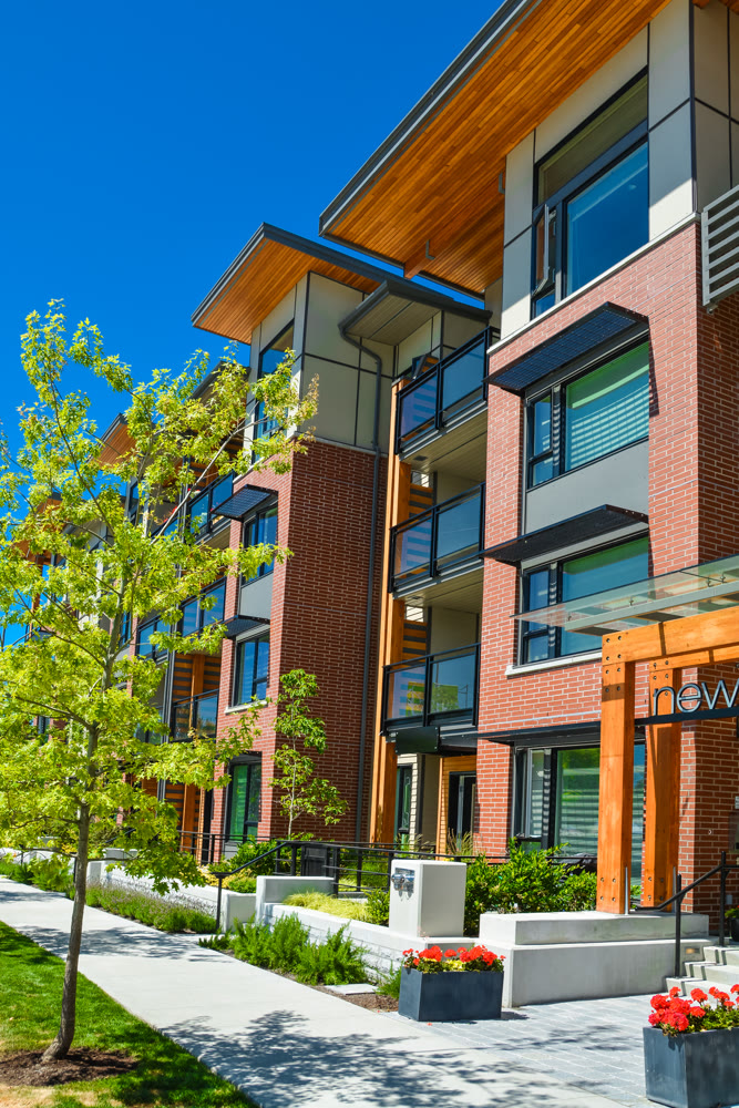 Brand new apartment building on sunny day in British Columbia, Canada.