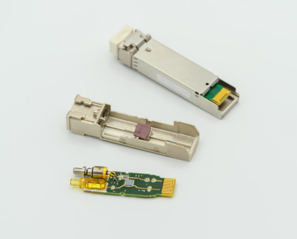 Small Form-factor Pluggable SFP nework module disassambled.