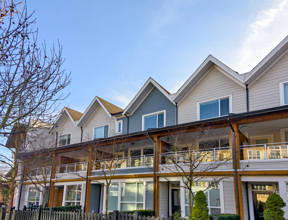 Row of nice residential townhouses on winter day in British Columbia, Canada