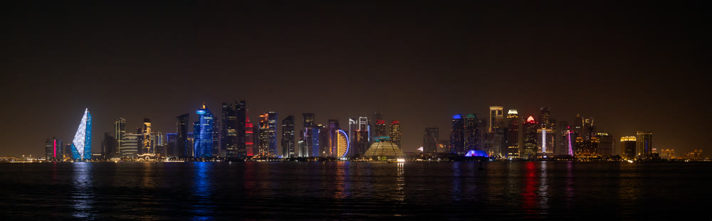 Panoramic view of big city downtown over an ocean galf