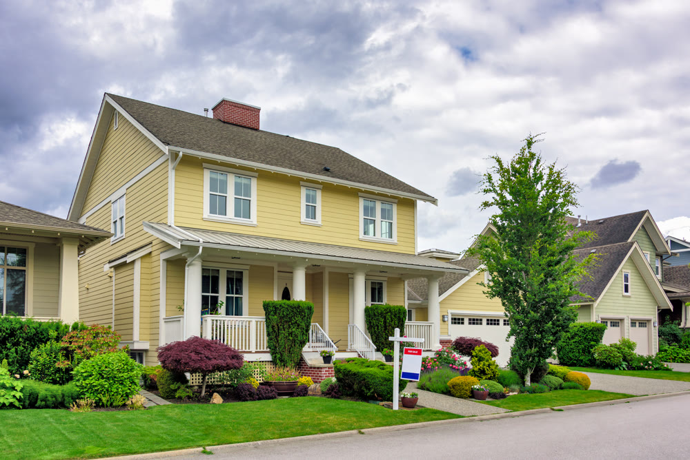 A perfect neighborhood. Nicely landscaped front yard of luxury residential house for sale