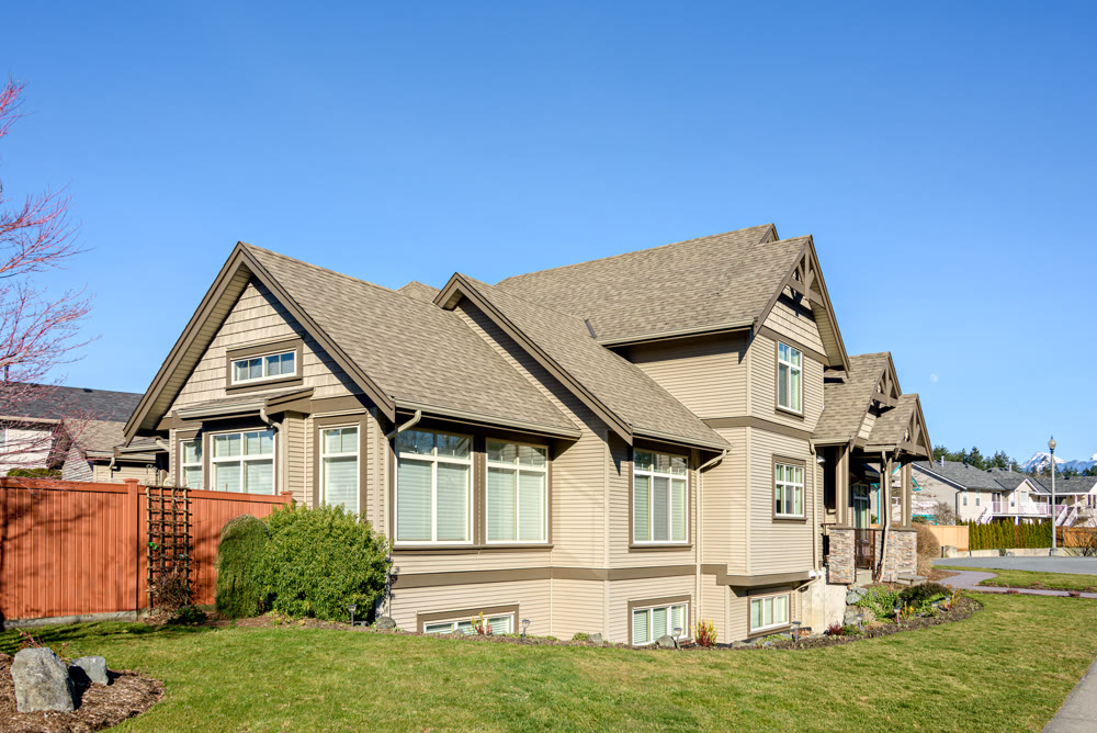 Street of residential houses on bright, sunny winter day in British Columbia