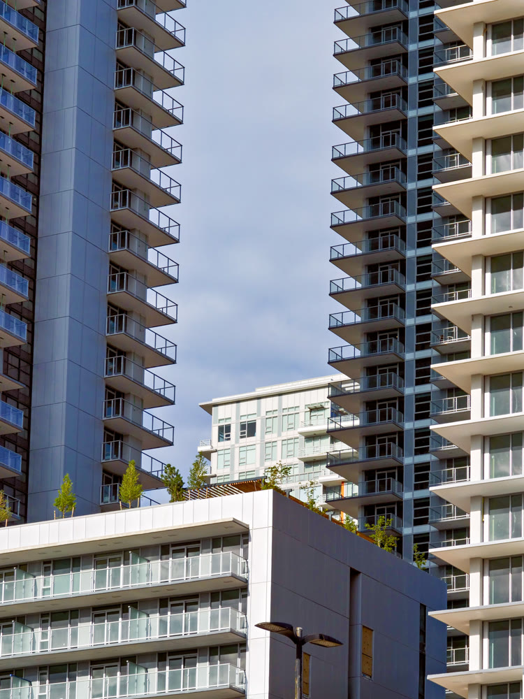 New high rise residential buildings on overcast sky background