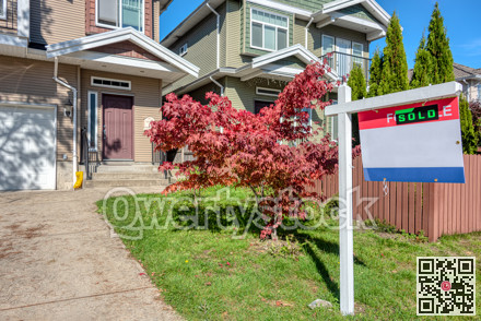 Real Estate Sold and House For Sale Sign