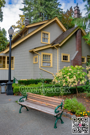 Historical residential house with wooden bench in front