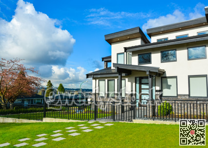 New residential house with concrete tile pathway and metal fence