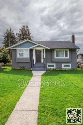 Average residential house in Canada on white sky background.